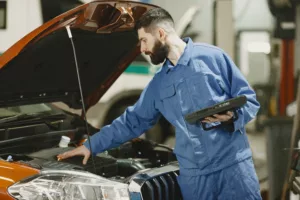 mechanic-checking-the-engine-of-a-car