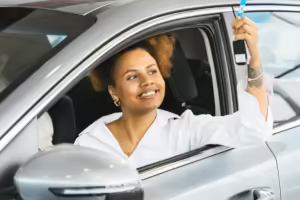 A Woman Inside a Car Showing Her Car Key