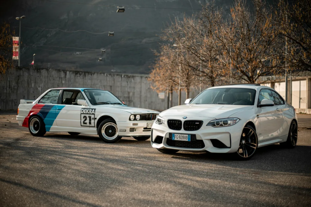 white bmw m 3 on road during daytime