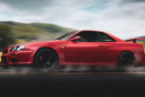 Red Nissan Gt-r R34 Skyline Running on Road