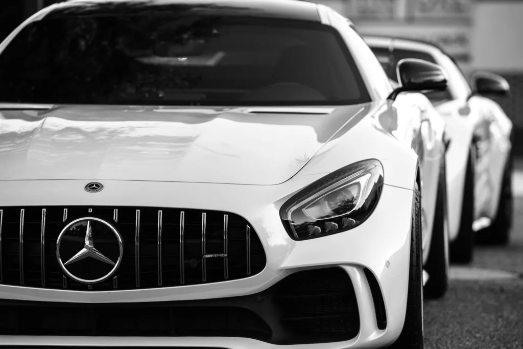 Grayscale Photo of a Luxury Car