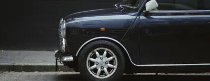 a small car parked on the side of the road