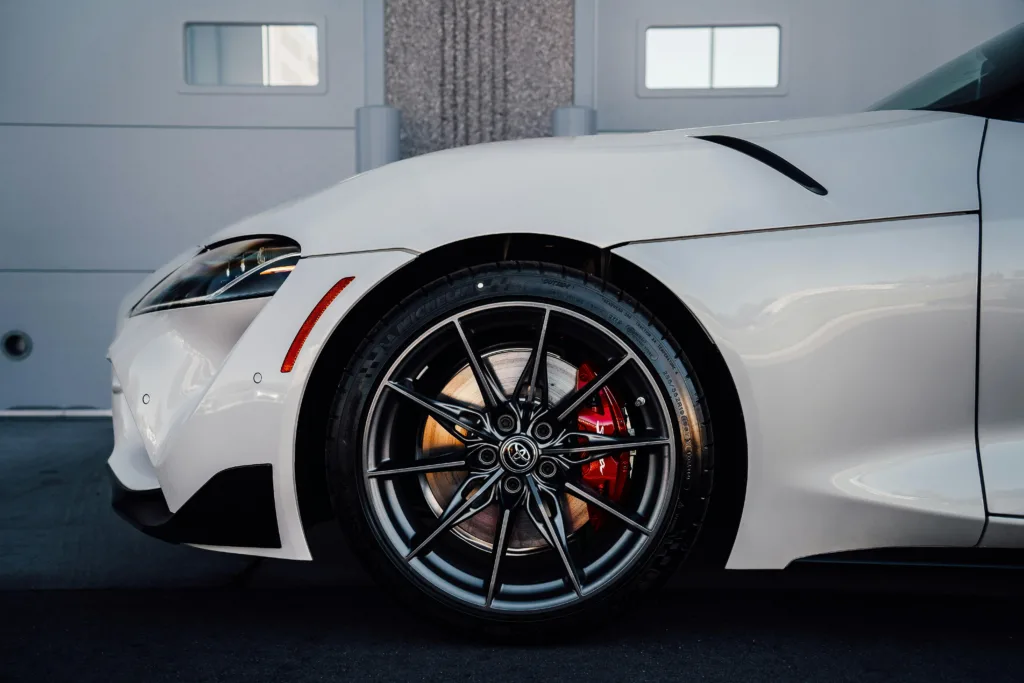 Close-Up of a White Sports Car Wheel
