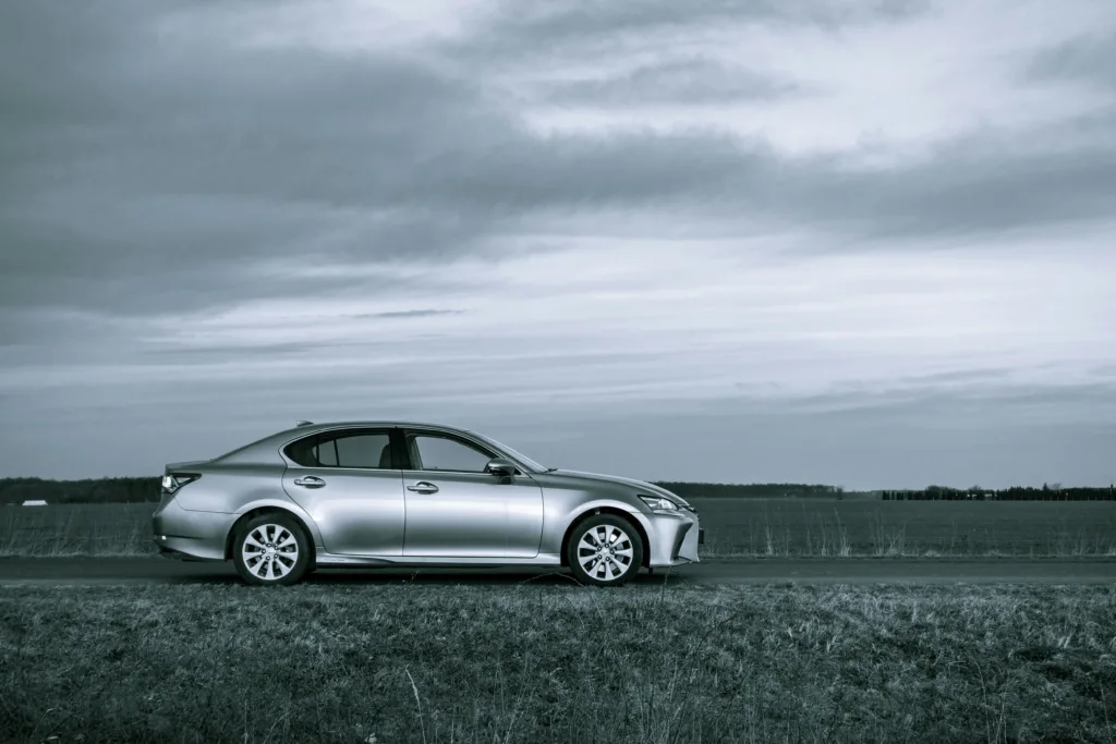 silver mercedes benz coupe on road under cloudy sky