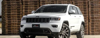 White Jeep Cherokee Suv Near Stacked Brown Pallet Boards