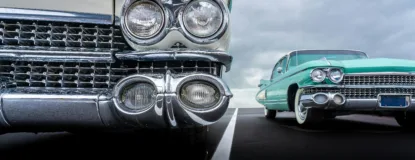 Vintage Cars Parked on Asphalt Road