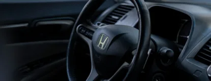 the interior of a car with a steering wheel