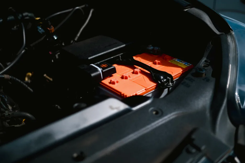 Detailed view of an electric car battery inside a vehicle's engine compartment