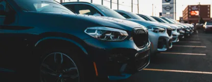 a row of cars parked in a parking lot