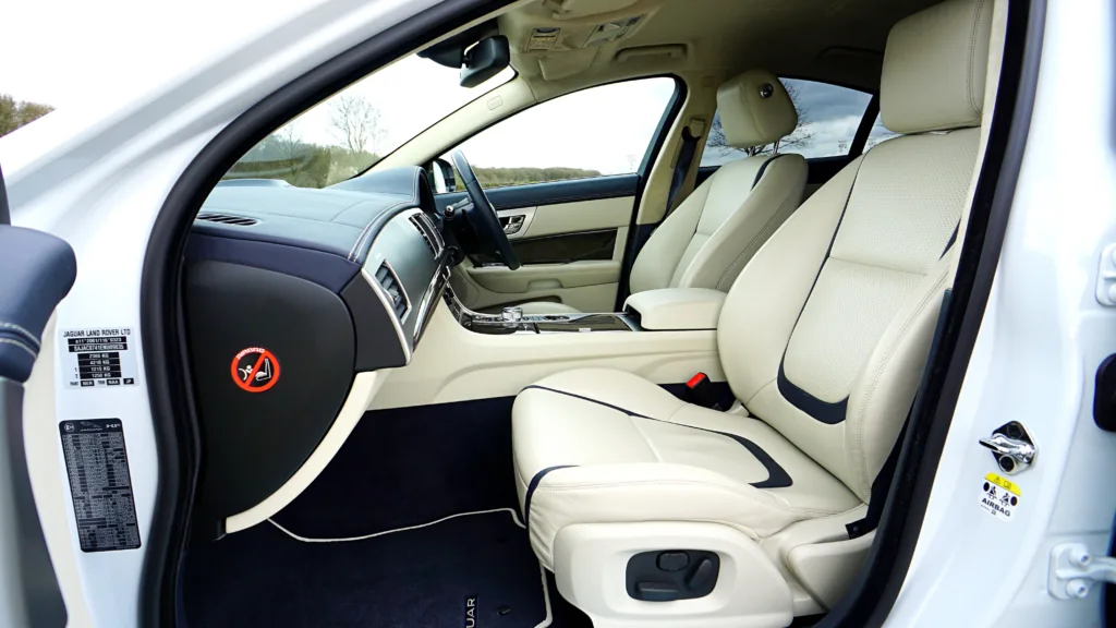 Elegant Jaguar XF car interior featuring premium leather seats and modern design elements.