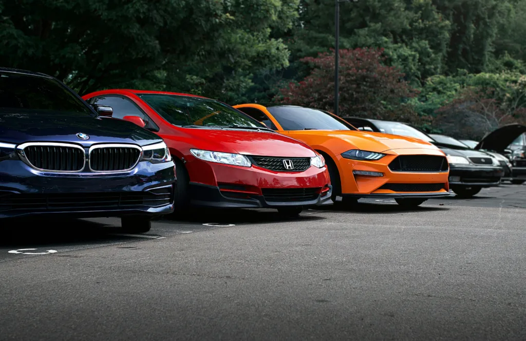 Several cars are parked in a row